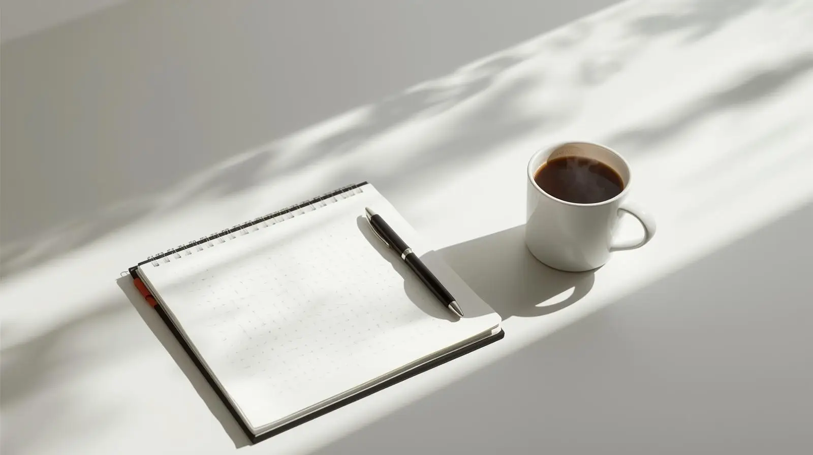 What to Expect Notebook, pen, and coffee on a clean workspace