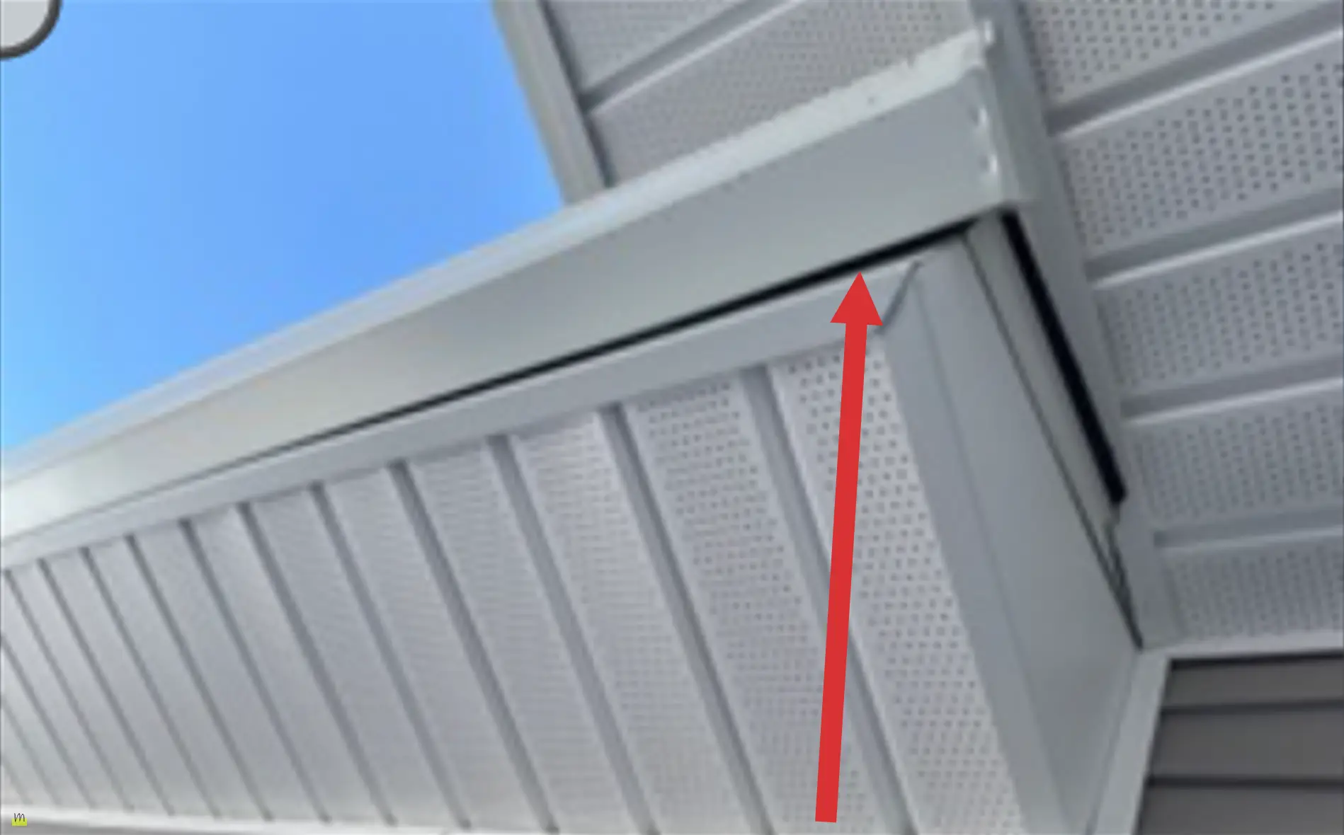 Gutter pulling away from fascia board along roof edge